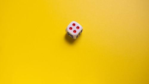 High angle view of ring on yellow table