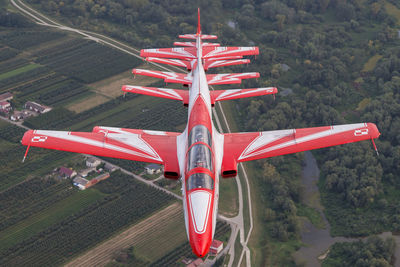 High angle view of airplane flying over landscape