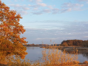 Scenic view of lake against sky during autumn