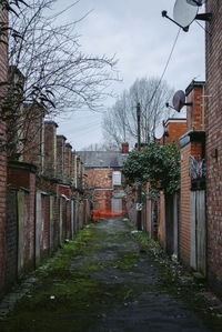 Street amidst buildings against sky