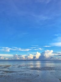 Scenic view of sea against blue sky