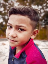 Close-up portrait of boy looking away