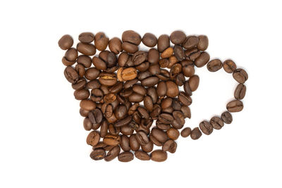Directly above shot of coffee beans against white background