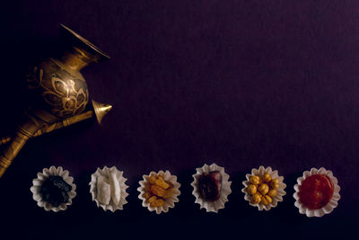 High angle view of flowers on table against black background