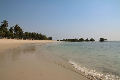 View of beach against clear sky