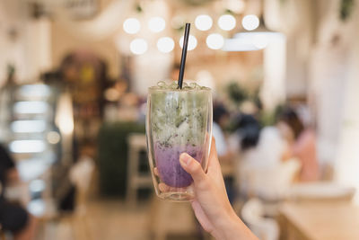 Close-up of hand holding drink