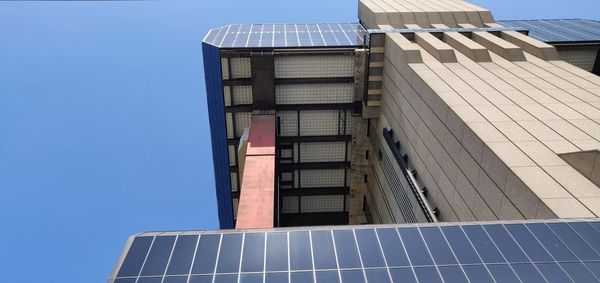 Low angle view of building against blue sky