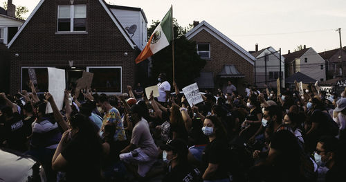 Group of people in front of buildings in city