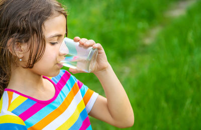 Young woman drinking water