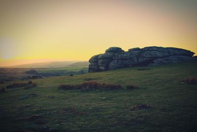 Scenic view of landscape against sky during sunset