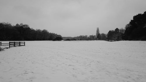 Scenic view of landscape against sky during winter