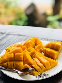 Close-up of fresh fruits in plate on table