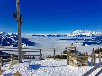 Scenic view of ski lift against blue sky