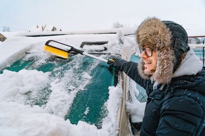 Rear view of man skiing on snow