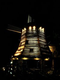 Low angle view of illuminated building at night