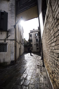 Narrow alley amidst buildings in city