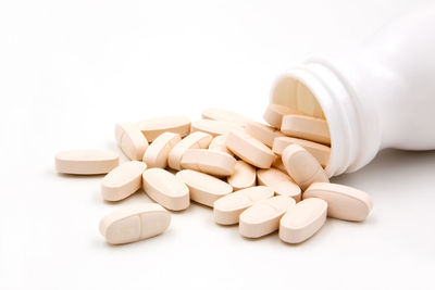 Close-up of coffee beans against white background