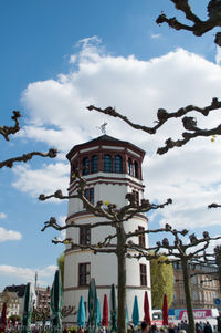 Low angle view of building against cloudy sky