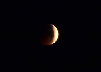 Low angle view of moon against sky at night