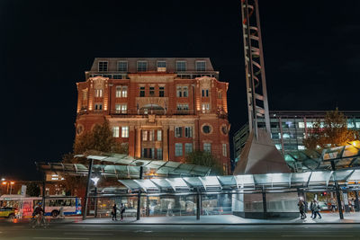 Buildings in city at night