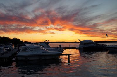 Boats in marina at sunset