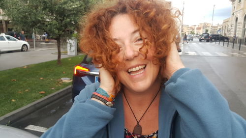 Portrait of smiling young woman outdoors