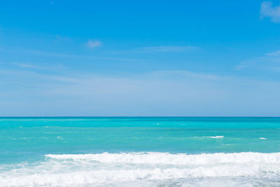 Scenic view of sea against blue sky