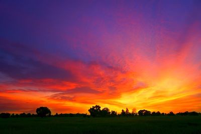 Scenic view of silhouette landscape against romantic sky at sunset