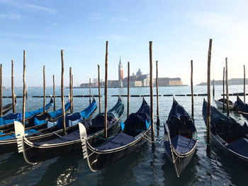 Boats moored at harbor