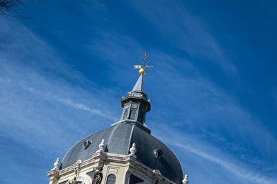 Low angle view of traditional building against blue sky