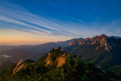 View of mountain range against cloudy sky