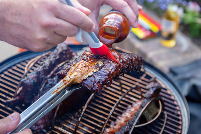 High angle view of meat on barbecue grill