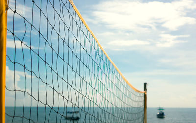 Beach volleyball net with blue sky