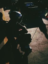 Portrait of man holding camera in city