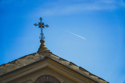 Low angle view of building against blue sky