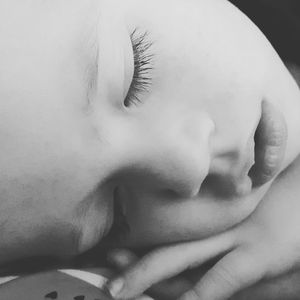 Close-up of young woman sleeping