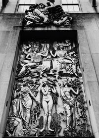 Low angle view of statue against building