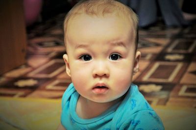 Close-up portrait of cute baby boys at home