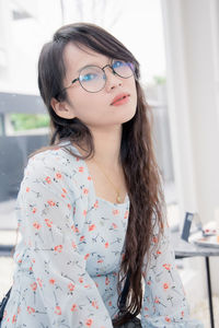 Portrait of smiling woman sitting at restaurant