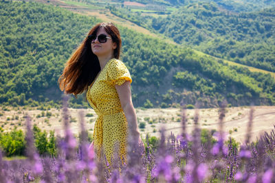 Woman standing on field