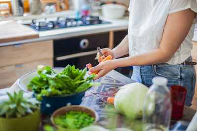 Close-up of woman preparing food at home