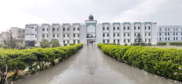 View of buildings against cloudy sky