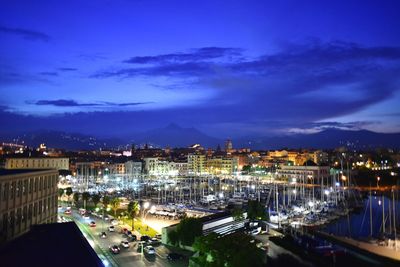 High angle view of illuminated buildings in city at night