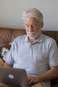 Young man using laptop at home