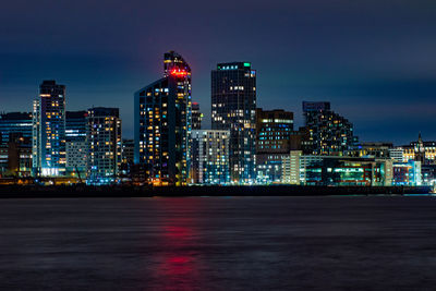 Illuminated buildings in city at night