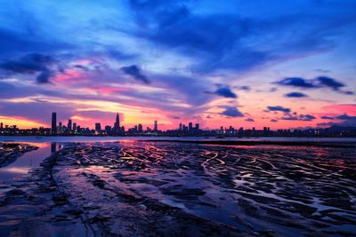 View of cityscape against sky during sunset