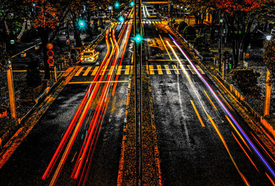 High angle view of light trails on road at night