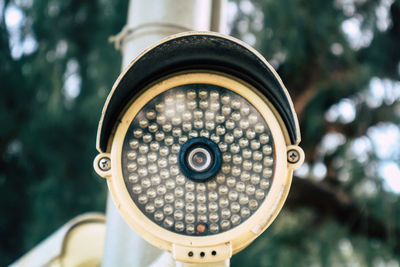 Close-up of coin-operated binoculars against blurred background