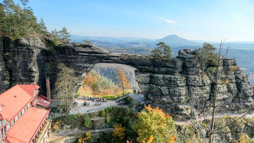 Scenic view of rock archway against sky