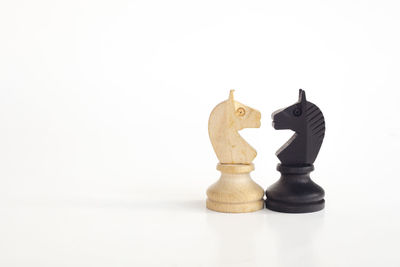 Close-up of chess against white background